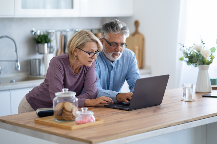A couple reviewing their retirement portfolio.